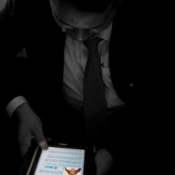 Panakkad Sayyid Munawwarali Shihab Thangal absorbed in reading 'The Sufi Booklover who waited on the Roadside', a poem about his late father, from the iJaihoon app on iPad (Jan 20 2012)