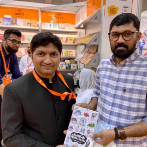Rafeek got the copy to his delight, after waiting patiently for the author to reach the stall. 