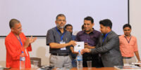 Dr. K Mohammed Basheer, Vice chancellor of University of Calicut, being presented with Slogans of the Sage, compilation of aphorisms by Sayyid Shihab Thangal