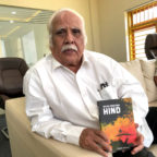 KKN Kurup holding The Cool Breeze From Hind, historical fiction by Mujeeb Jaihoon